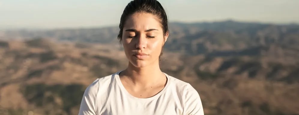a woman sitting in a yoga pose