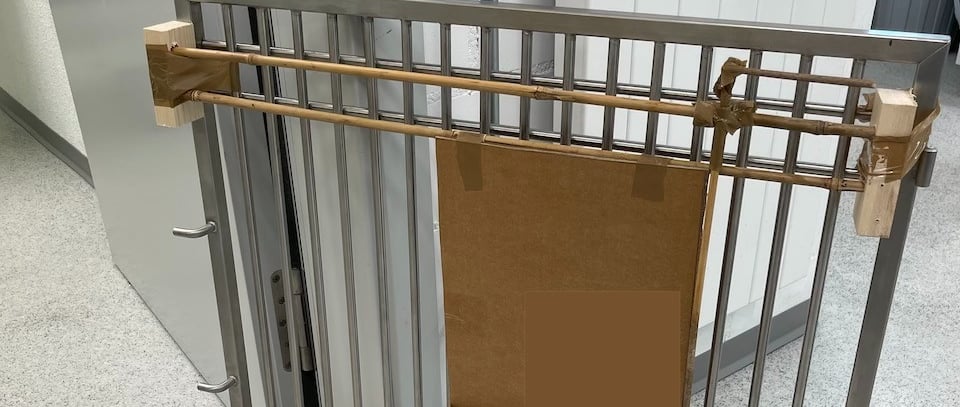 wood_and_cardboard_taped_onto_a_steel_door_prototype