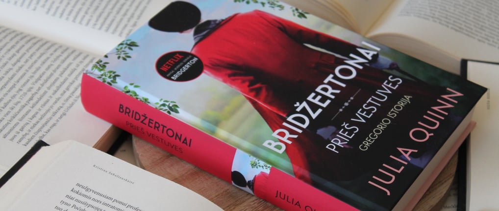 a book with a bookmark on it and a book on a table