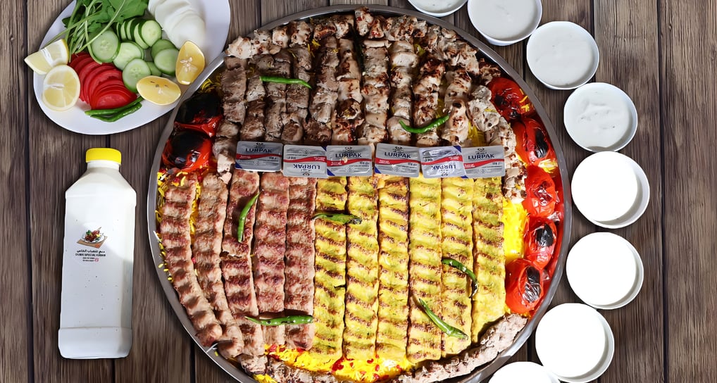 a pizza with meat and vegetables on a table