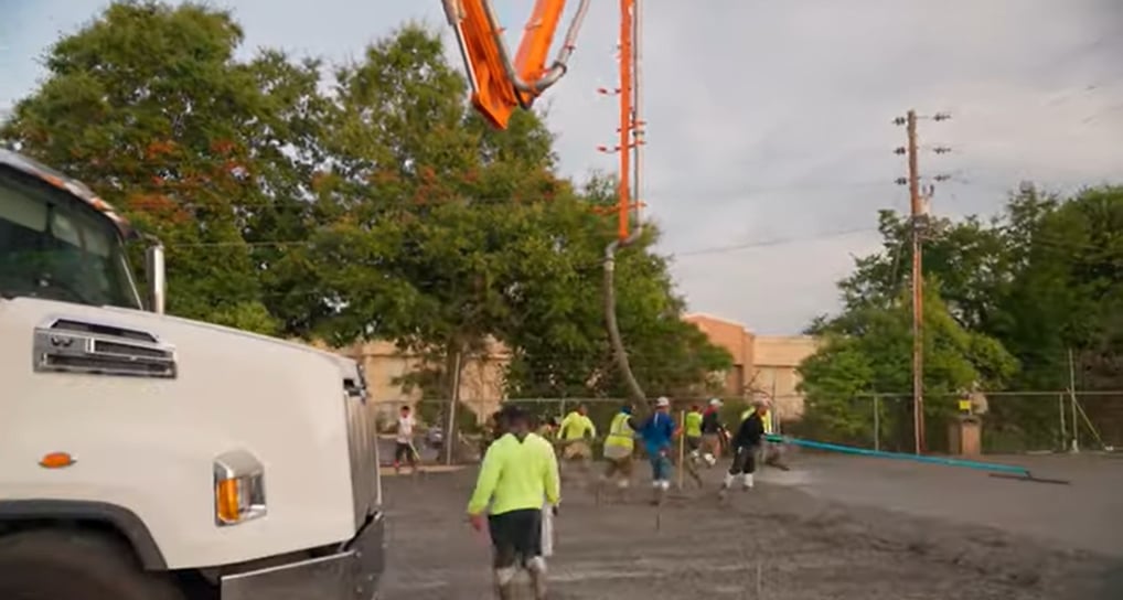 Using a long arm for pouring concrete