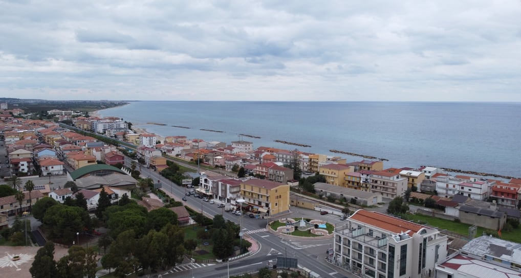 a city street scene with a view of a city torre melissa
