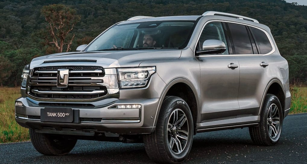 a silver suv parked on a road