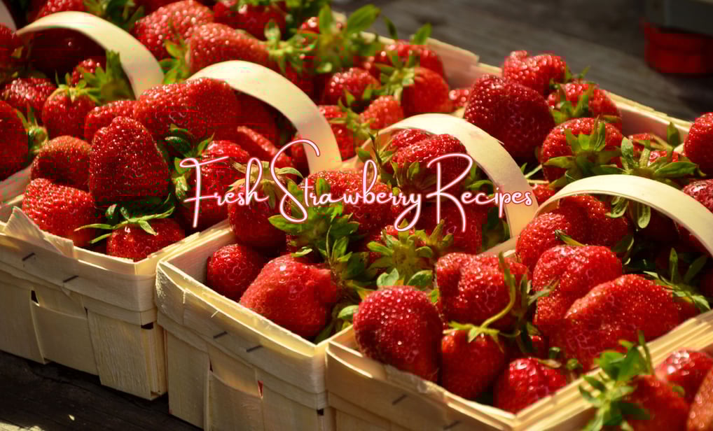baskets of strawberries are displayed in baskets