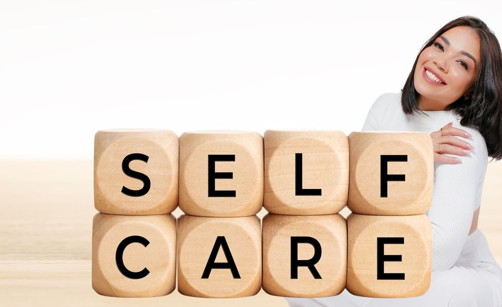 a woman sitting with a wooden block with the words self care