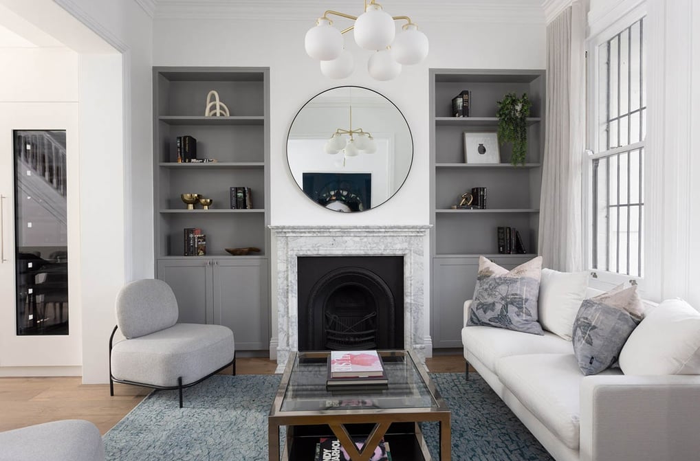 Lounge room in Surry Hills, featuring modern interior design, fireplace, custom joinery, bookshelves