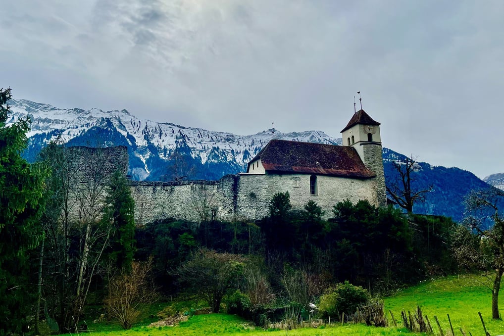 Looking up at Riggenberg Church and castle in Ringgenberg Switzerland outside of Interlaken