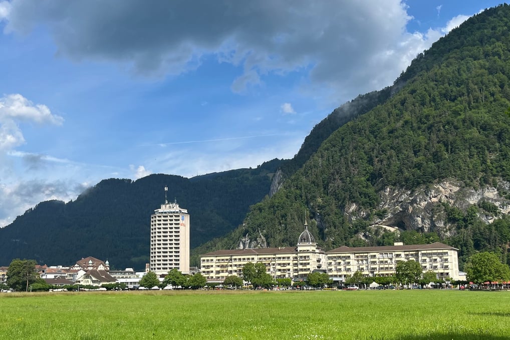 Looking across the Höhematte at Hotel Metropole and Victoria-Jungfrau in Interlaken Switzerland