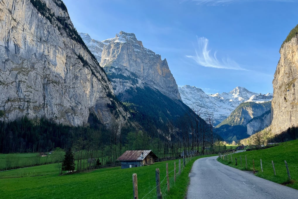 View looking up the Lauterbrunnen Valley in Switzerland with limestone cliffs towering above