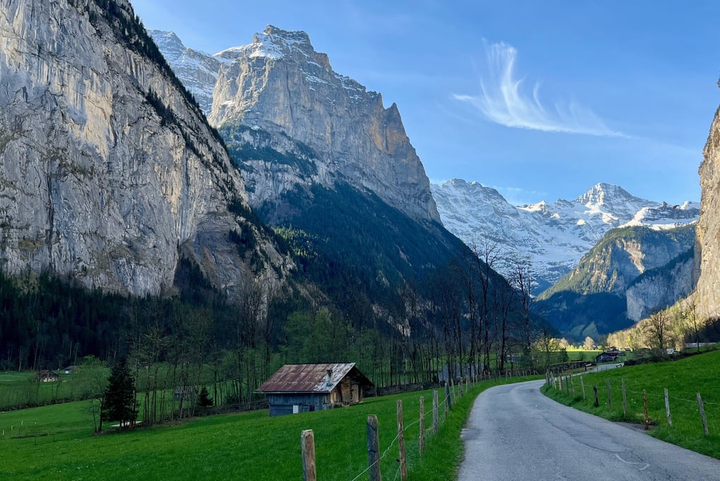 View looking up the Lauterbrunnen Valley in Switzerland with limestone cliffs towering above