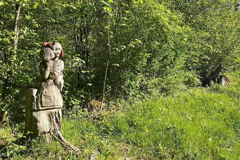 Wood carvings along the Entschlige river outside of Frutigen
