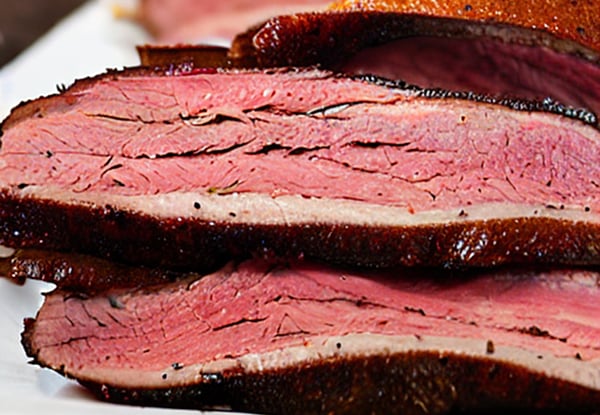 a plate of baked pastrami meat