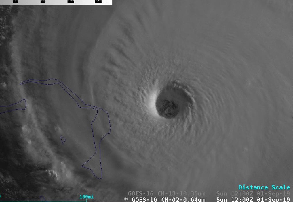 Sunlight and shadows help reveal the stadium or cone like shape of clouds of the eyewall in Hurricane Dorian (2019). (NOAA)