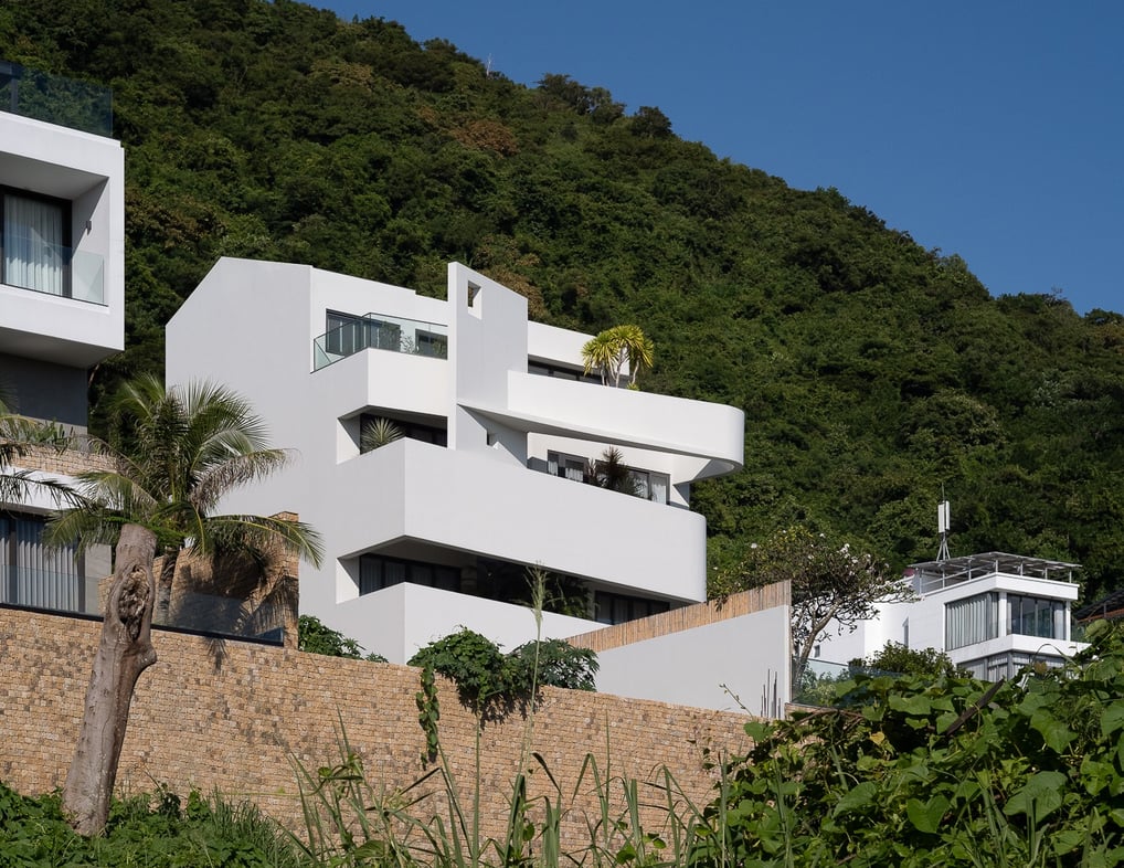 a house with a cable car going up a hill