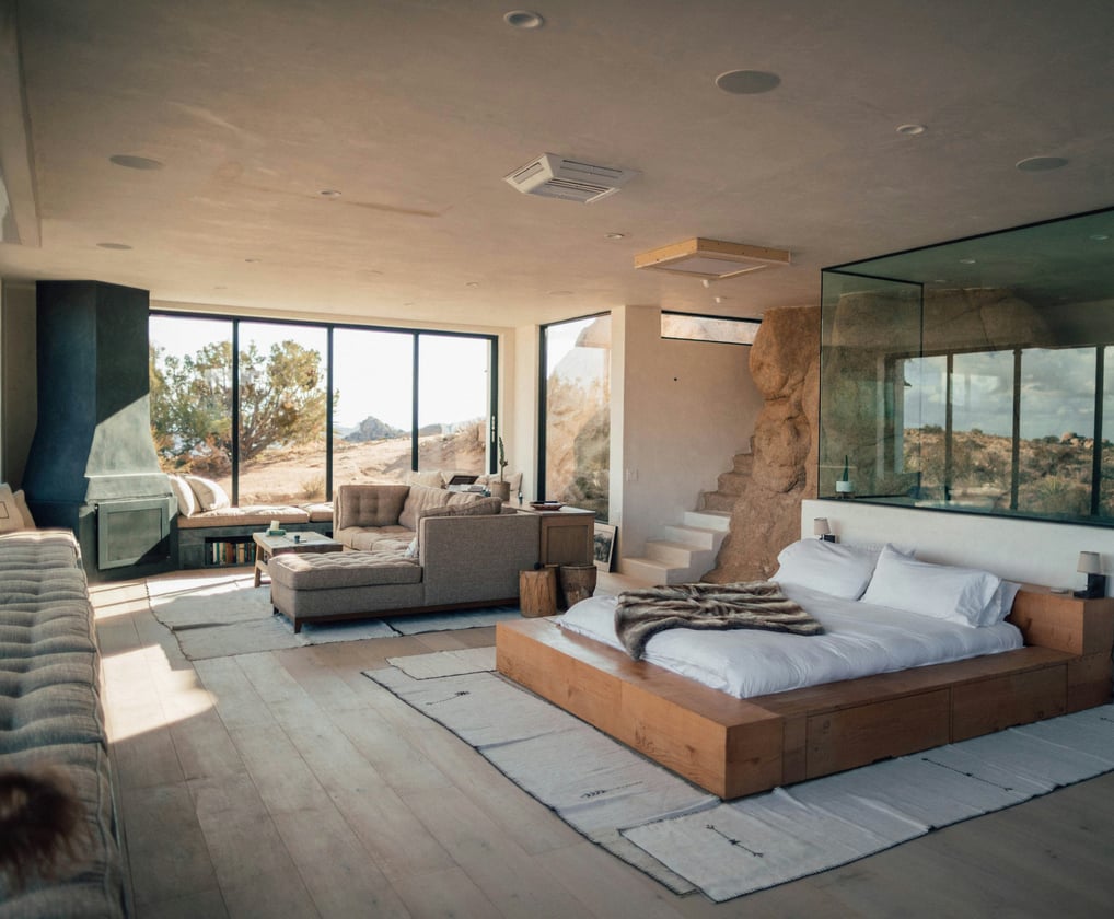 a bedroom with a bed and a couch