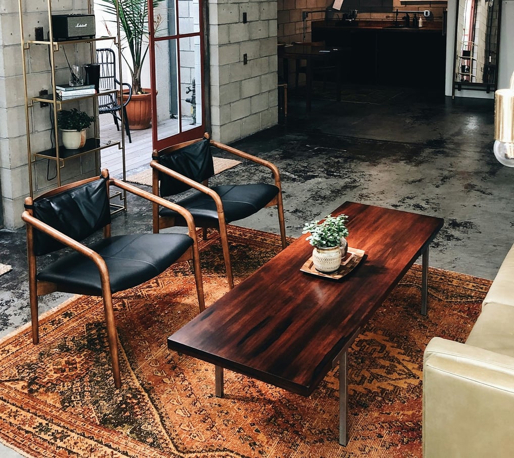 a living room with a couch and chairs
