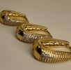 a row of gold - plated earrings with a pair of earrings