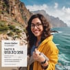 a woman in a yellow jacket and glasses holding a sign that says,'tis