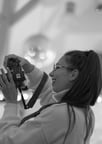 a woman taking a picture of herself taking a picture of herself