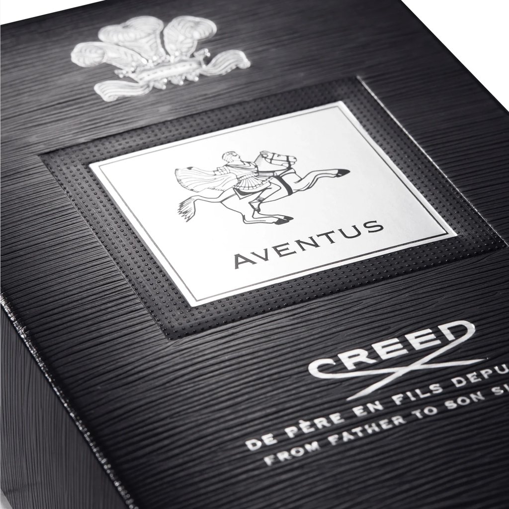 Luxury black textured box for Creed Aventus cologne featuring the silver embossed brand logo and horse rider icon.