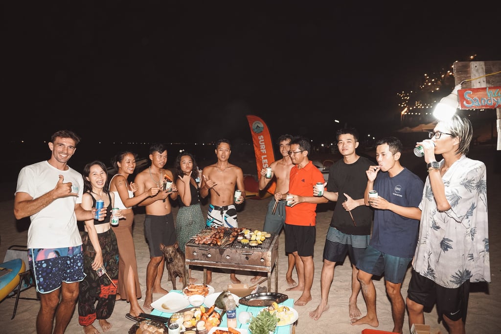 International and local surfers forming an authentic surf community at Bai Dai beach in Cam Ranh.