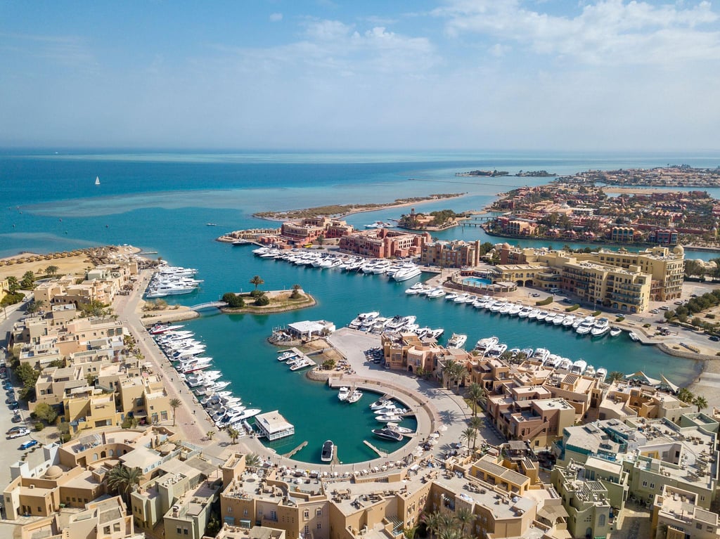 Aerial view of luxury yachts docked at the scenic Abu Tig Marina in El Gouna, Egypt.