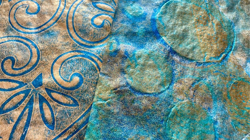 Blue and gold iridescent collage papers with layered stencil pattern