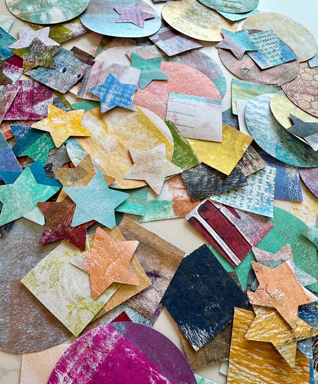 Colorful collage fodder shapes made from hand-painted papers