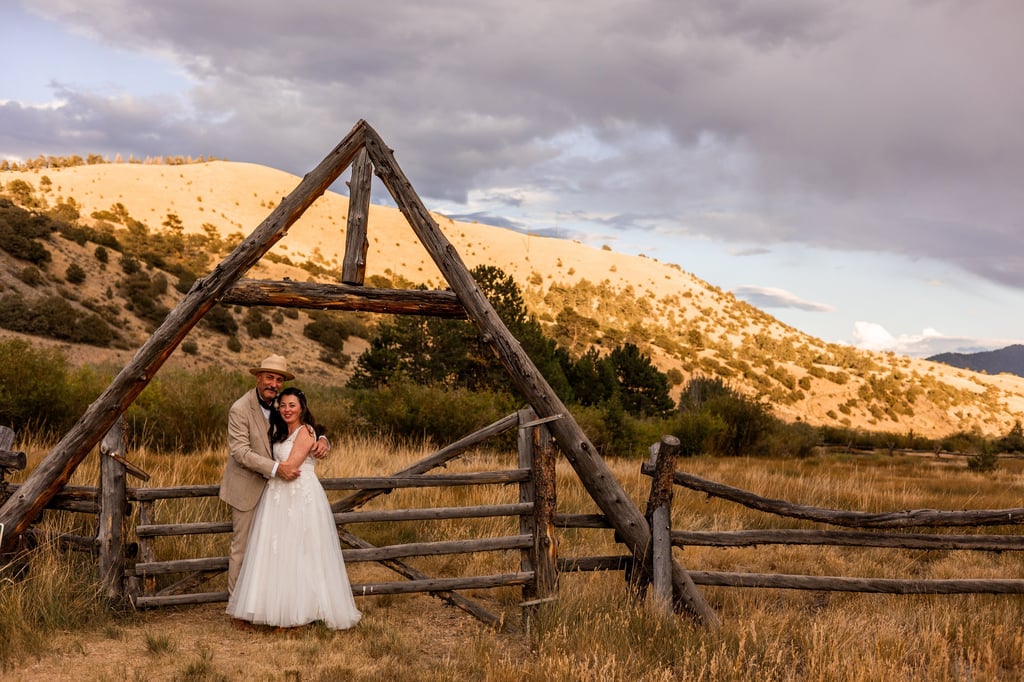 Bride and Father of the Bride in front of Ranch Fence