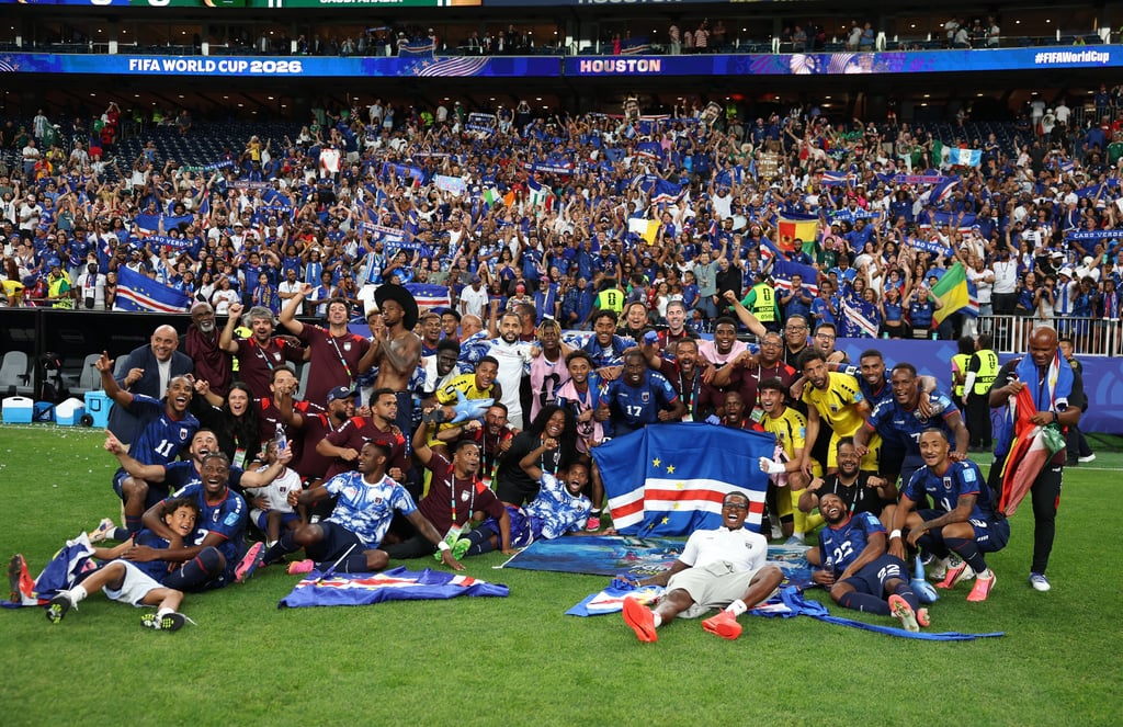 Cape Verde national soccer team celebrates on the field with fans at the FIFA World Cup 2026 qualifier.