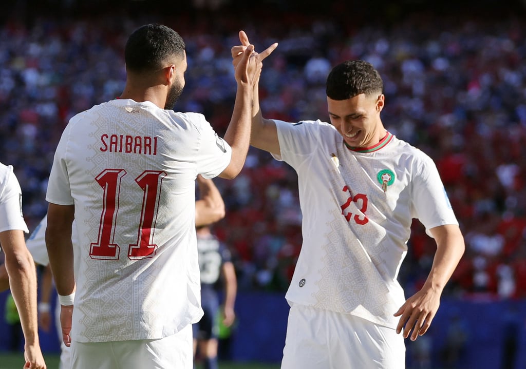 Morocco national football team players Ismael Saibari and Bilal El Khannouss celebrate a goal.