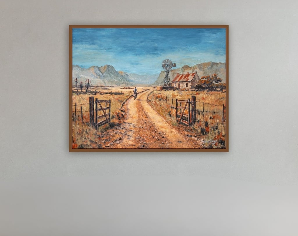 A framed original painting by Martin Osner called "Fields of Gold" shown displayed on a grey gallery wall