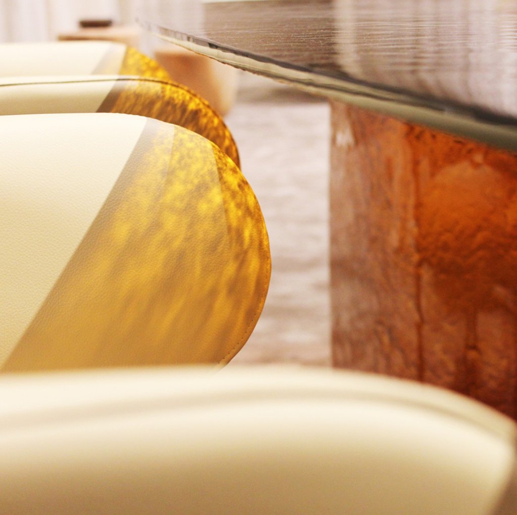 Detail of Blur table base and dining chairs — cast glass luminous effects by Naturedesign