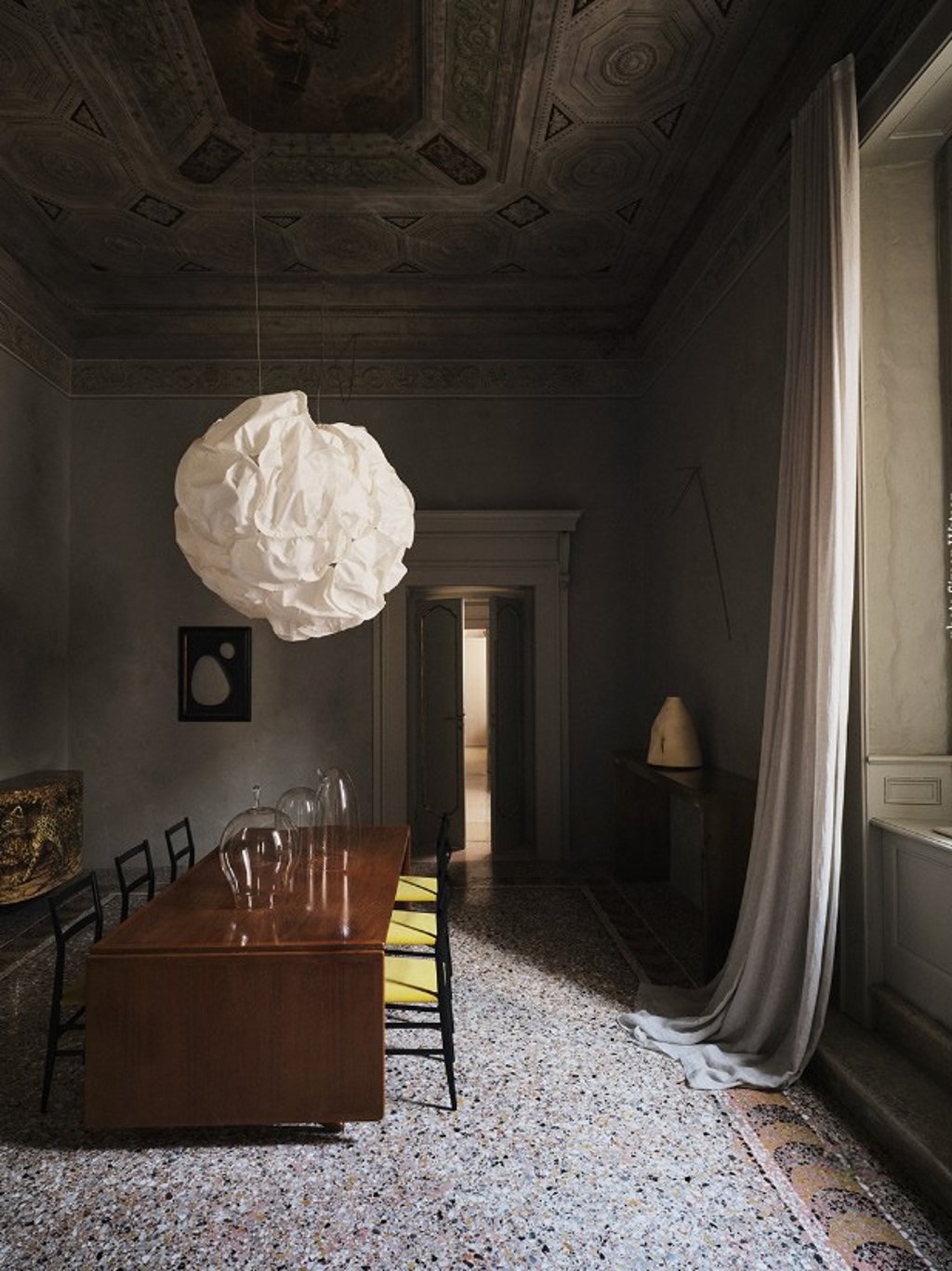 Gio Ponti table and Hans Wegner chairs in the frescoed salone of Palazzo Martinengo, Brescia. Photo Simon Watson