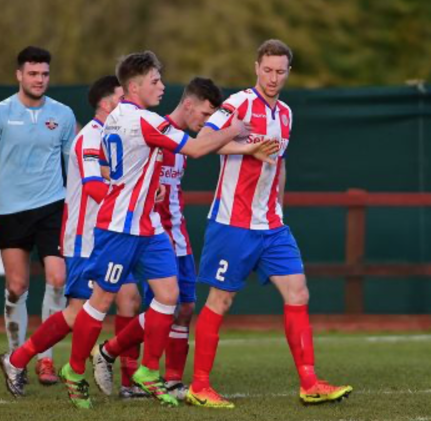 Robb Sheridan, semi professional footballer, celebrating with teammates during a match.