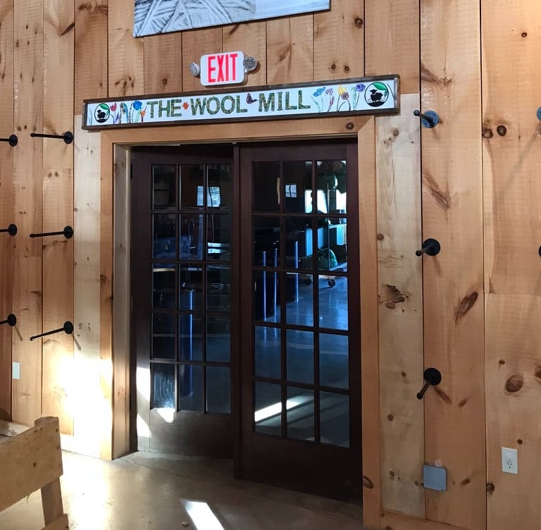 French doors retrofitted into doorway in barn business by Golden Rule Construction