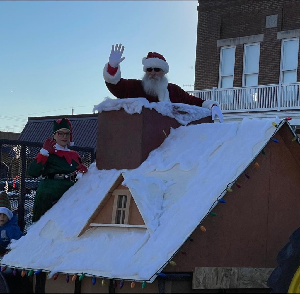 Santa Tom in chimney of parade float in Auxvasse Christmas Parade