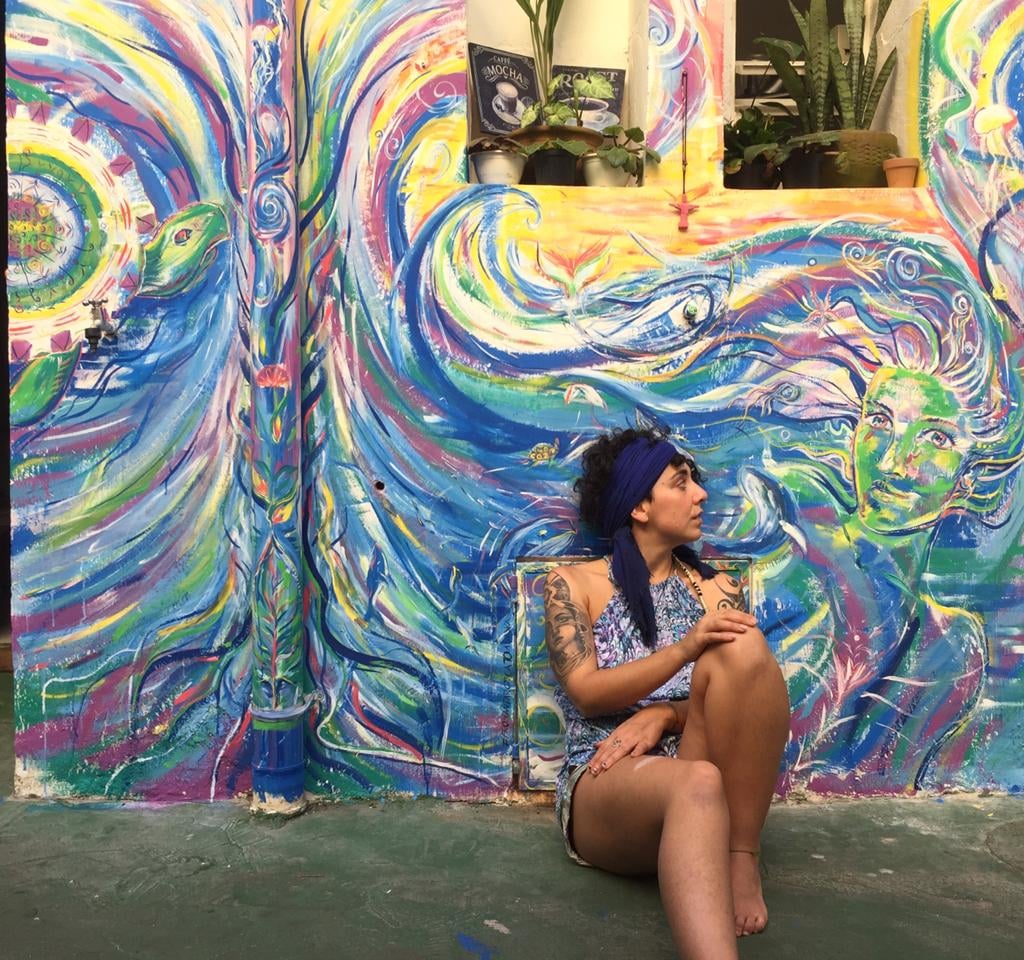 peinture murale réalisée à Rio de Janeiro avec un fond marin sirène et animaux marins sur un coucher de soleil
