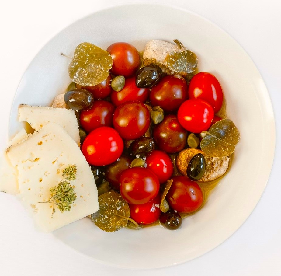 Cherry tomato salad with olives & Naxian cheese prepared by villa eats private chefs Naxos