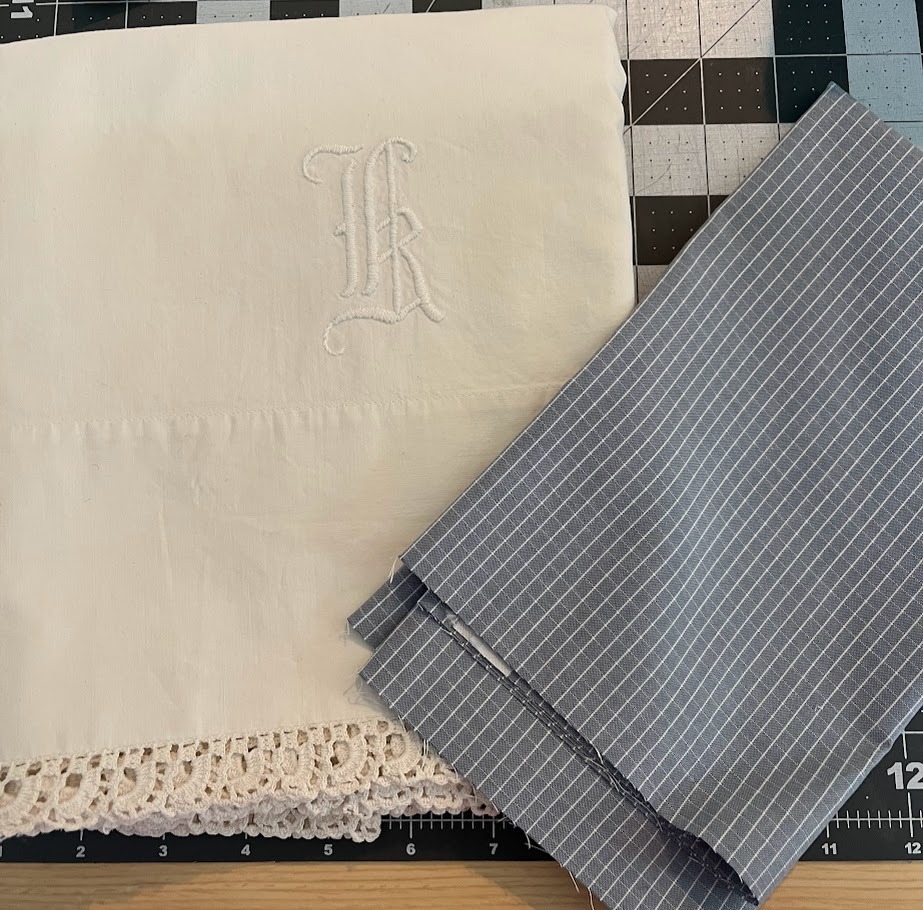 picture of an embroidered monogram pillowcase and the fabric used to make the back of a decorapillow