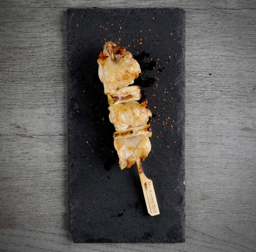 a skewer of chicken thigh ang green onion negima