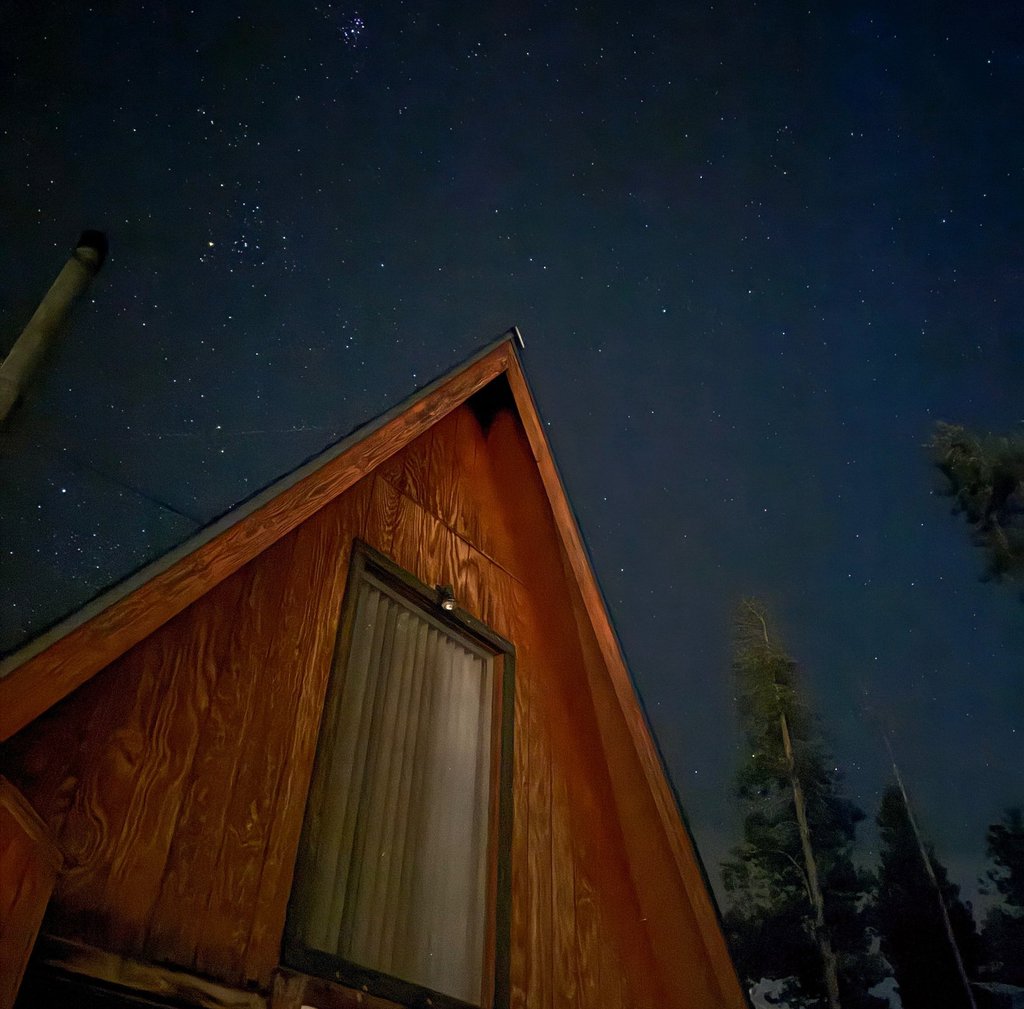 a house with a window and a starr sky