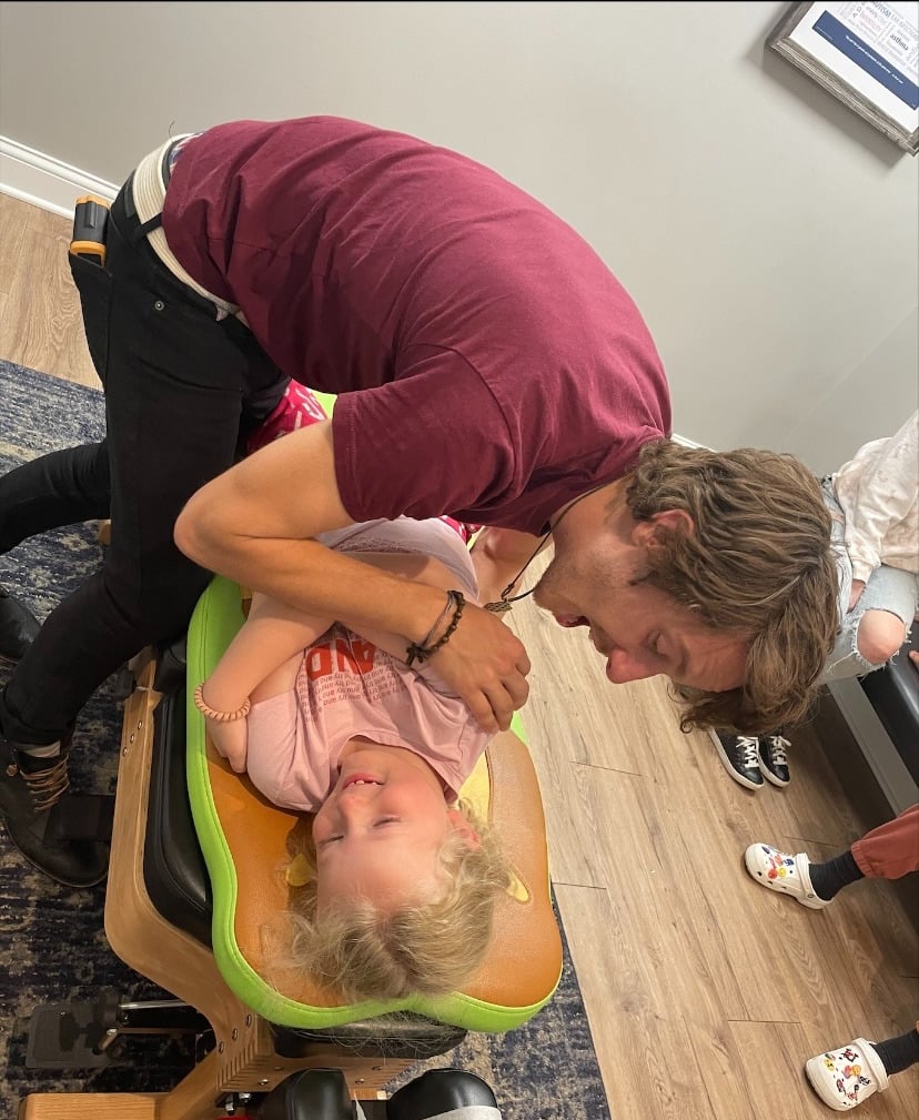 Franklin Pediatric Chiropractor adjusting child for Constipation and GI stress