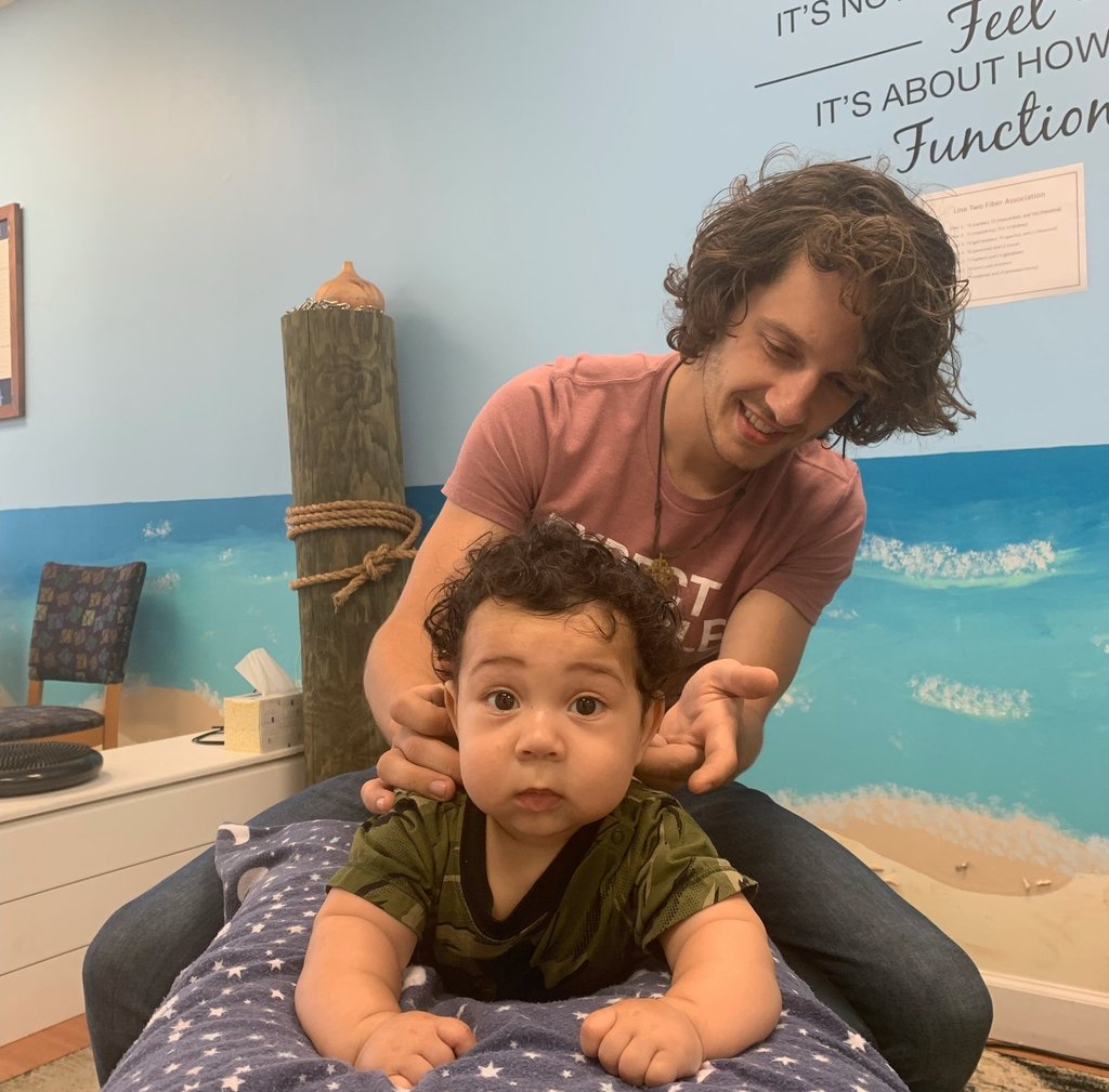 Peaceful infant sleeping soundly after a gentle chiropractic adjustment. Pediatric chiropractic care