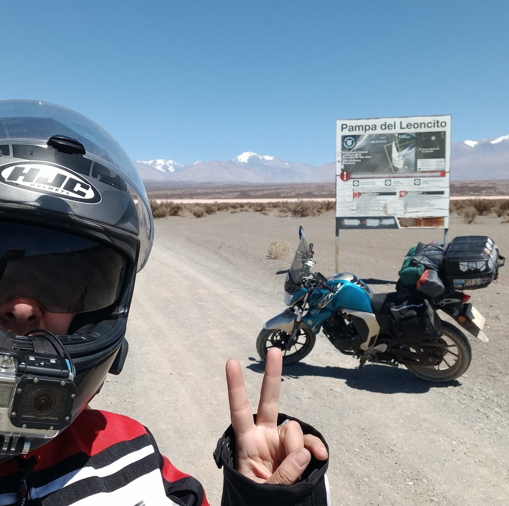 a man in a helmet and helmet on a motorcycle