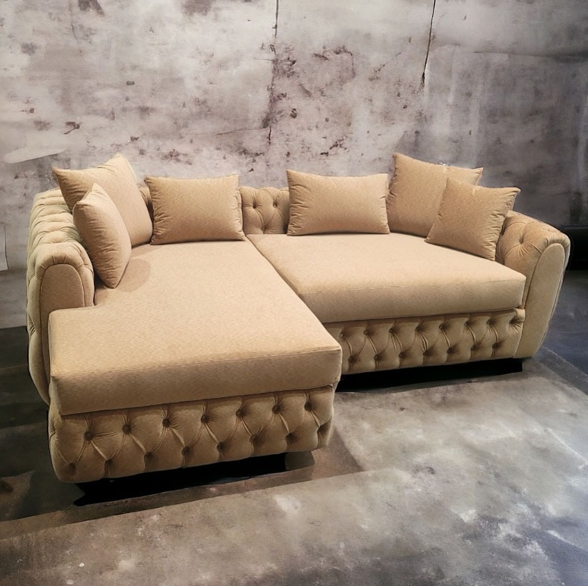 Beige tufted sectional with plush cushions and rolled arms, transitional furniture custom-designed