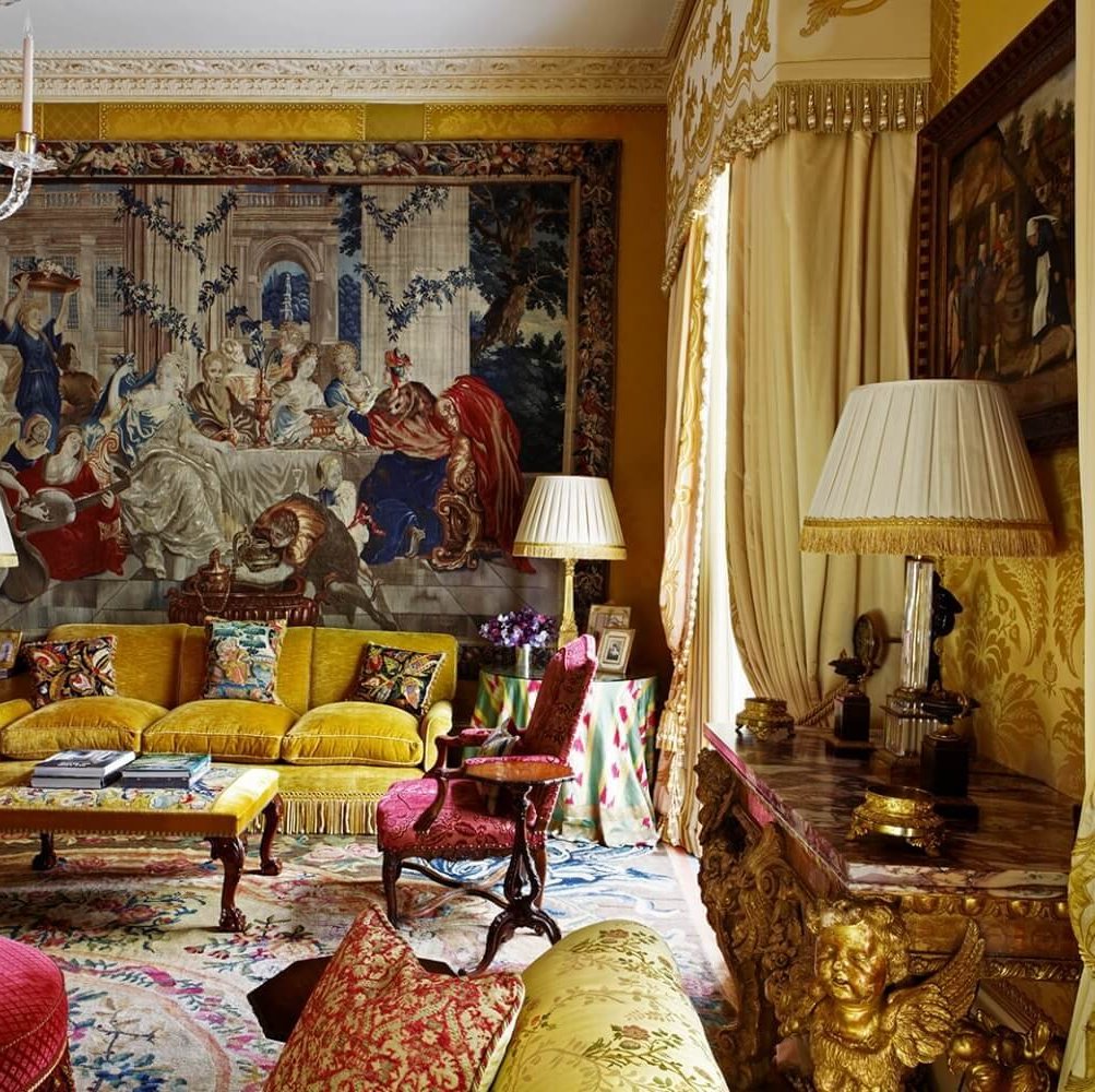 a living room with a couch and a chandelier Nour Nagy Designs London interior Design