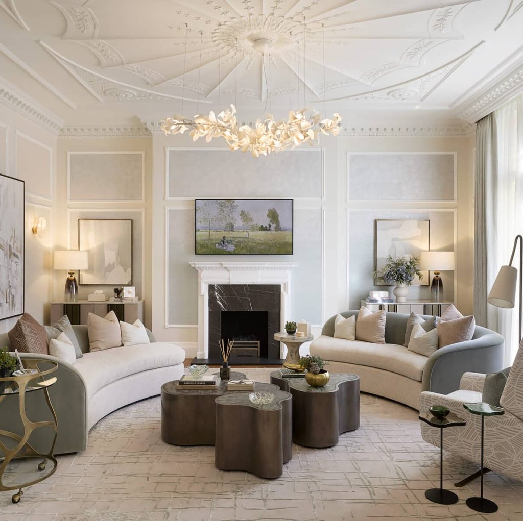 a living room with a couch and a chandelier Nour Nagy Designs London interior Design