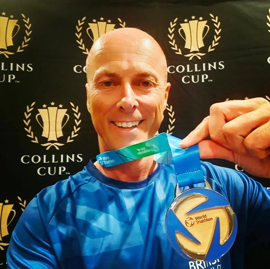 James Oswald Coaching holding a World Triathlon Silver medal World Championship & Collins Cup event.