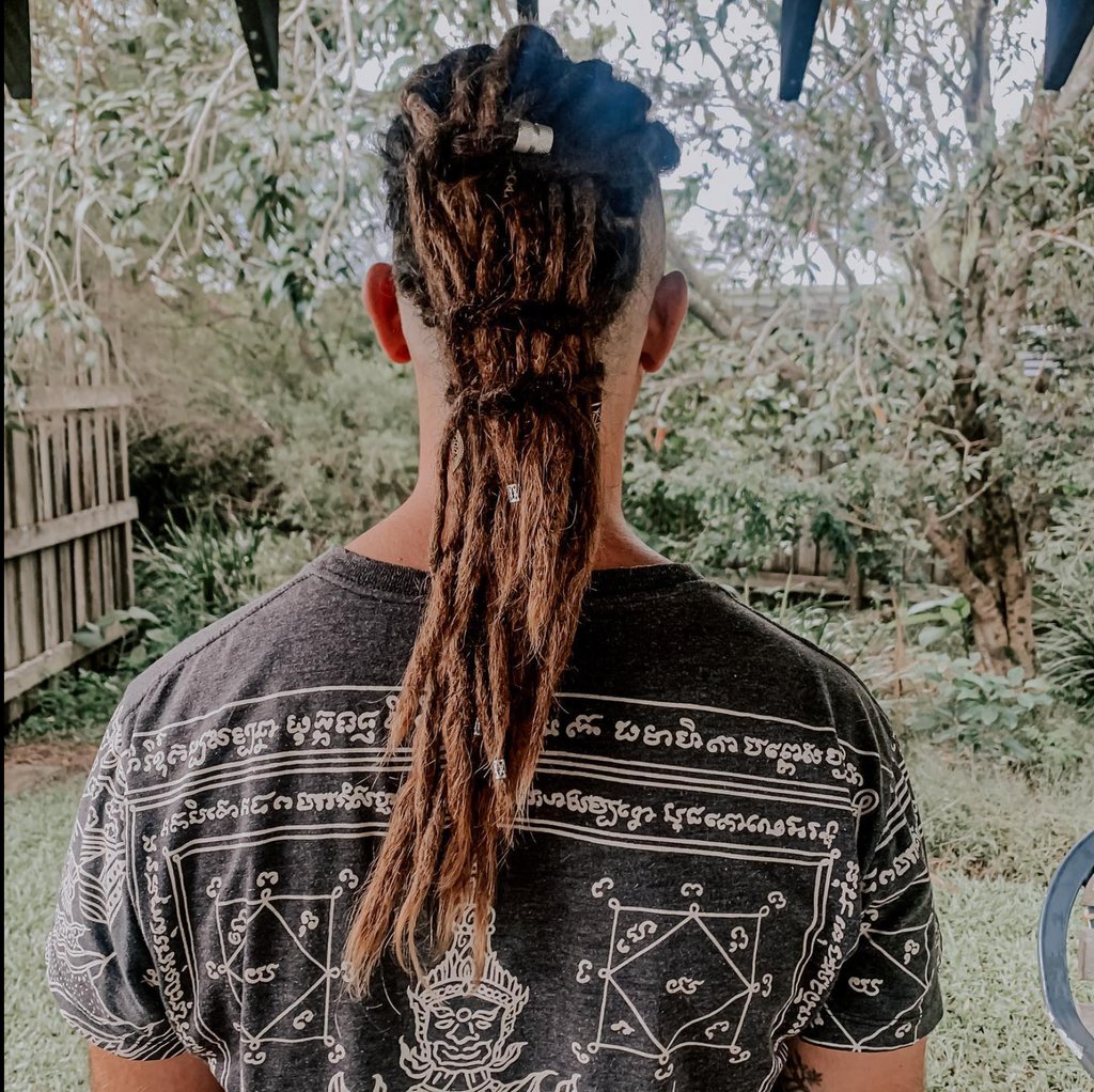 a man with dreadlocks and dreadlocks on his hair